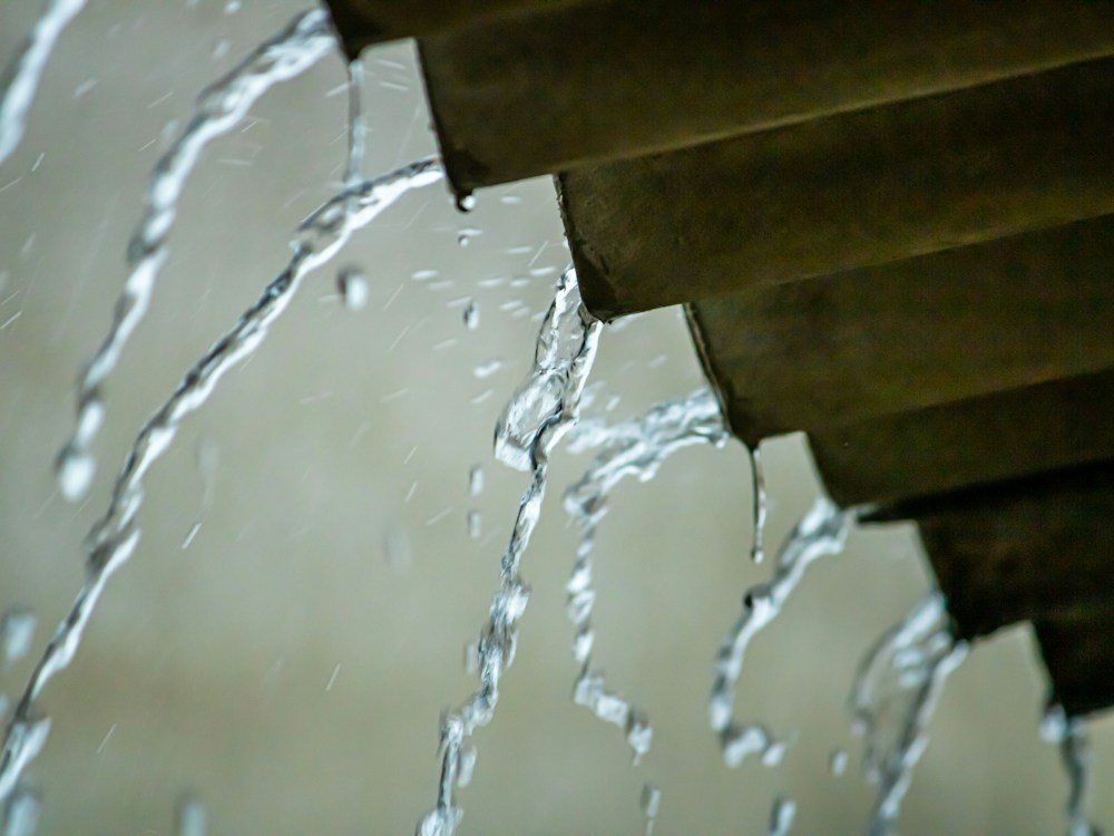 Water pouring from a leaking pipe