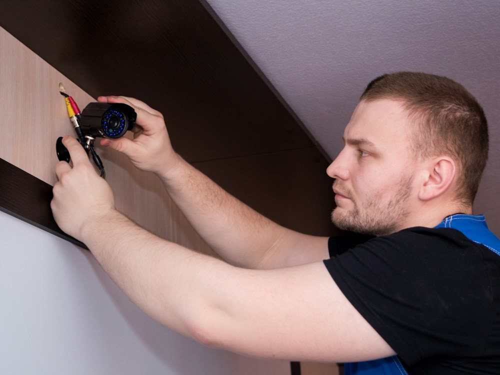 Technician checking a damaged wall